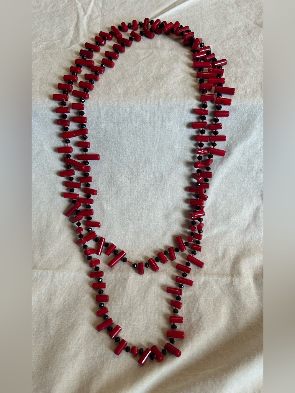 Hand crafted Red Agate and black beads on red silk thread